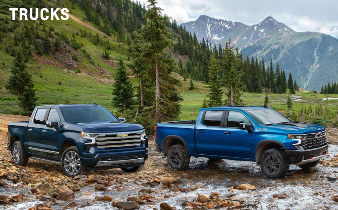 Chevrolet trucks navigating a rocky mountain terrain, highlighting off-road performance, towing capability, and reliable truck maintenance for tough outdoor conditions.