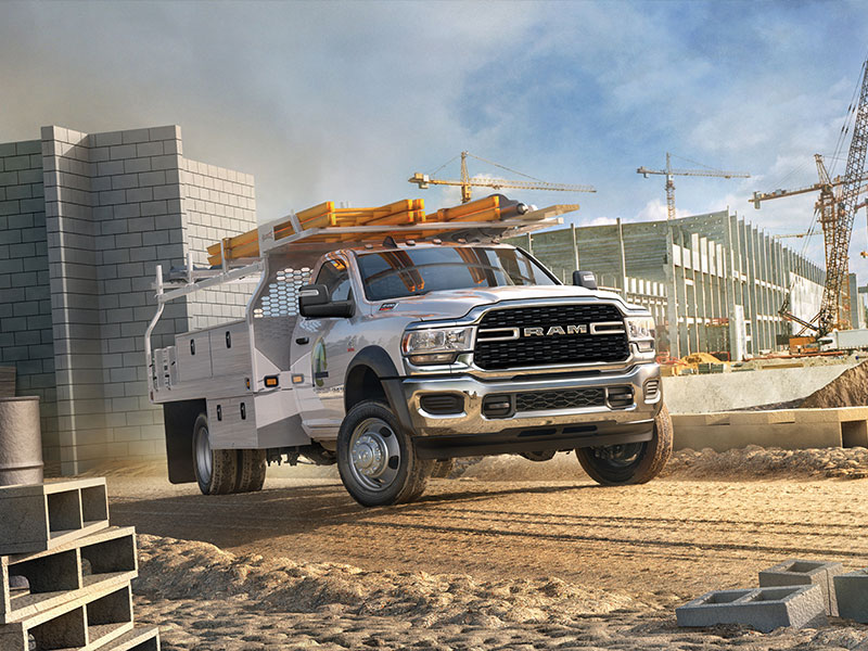 RAM commercial truck at a construction site carrying equipment, emphasizing heavy-duty performance, job-site reliability, and RAM truck maintenance services for commercial and fleet vehicles.