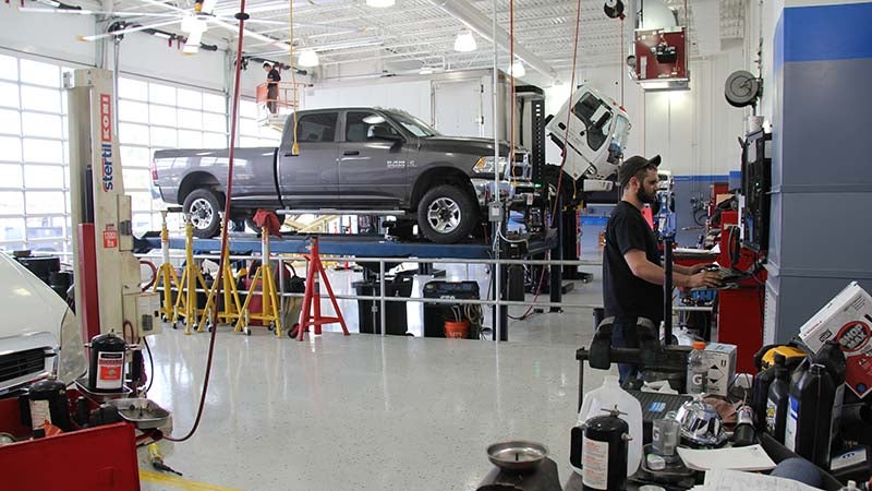 A mechanic and trucks at service center