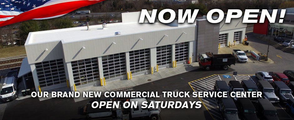 Lot of vehicles parked front of service center building