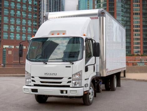 Isuzu Truck Parked front of building